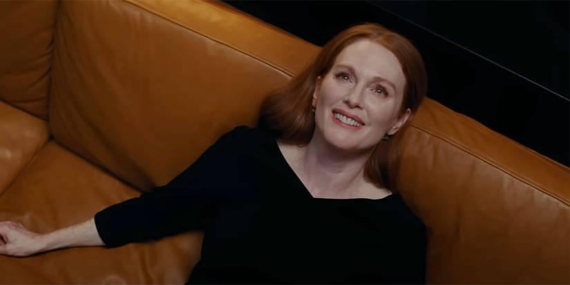 Madeline lying down and smiling widely in Sharper