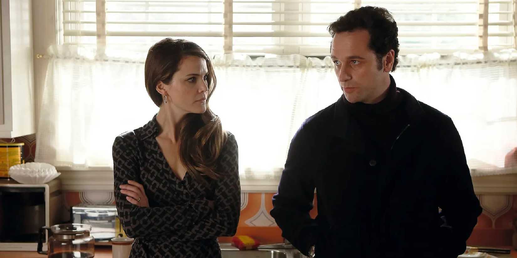 Elizabeth (Keri Russell) and Phillip Jennings (Matthew Rhys) looking pensive in The Americans.