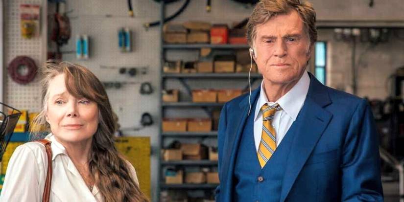 Robert Redford and Sissy Spacek standing next to each other in front of a counter in The Old Man and the Gun