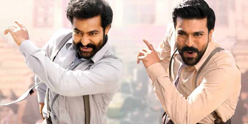 The two main characters smiling and dancing in RRR.