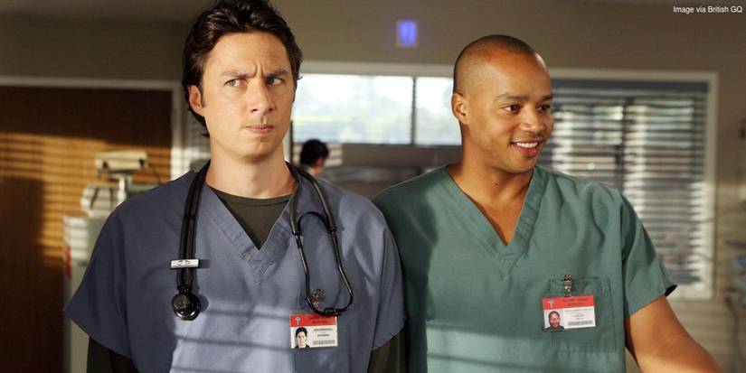 J.D. and Turk from Scrubs in their hospital scrubs looking in opposite directions with goofy faces.