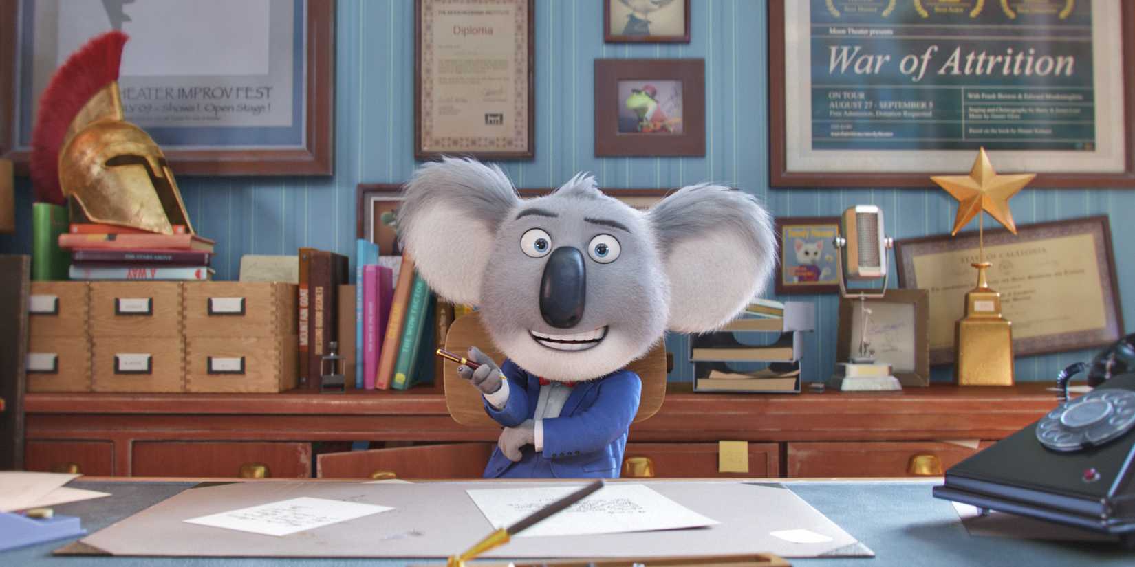 A koala in a suit and tie talks to the camera in a still from Sing, 2016.