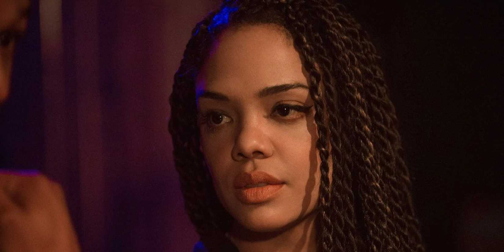 Tessa Thompson as Bianca Taylor looking at something or someone off-camera in Creed.