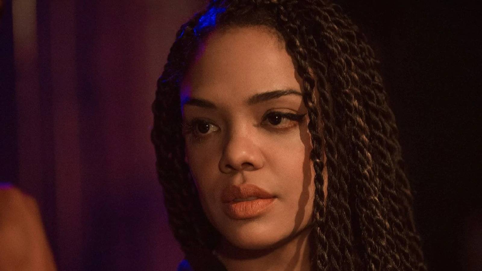 Tessa Thompson as Bianca Taylor looking at something or someone off-camera in Creed.