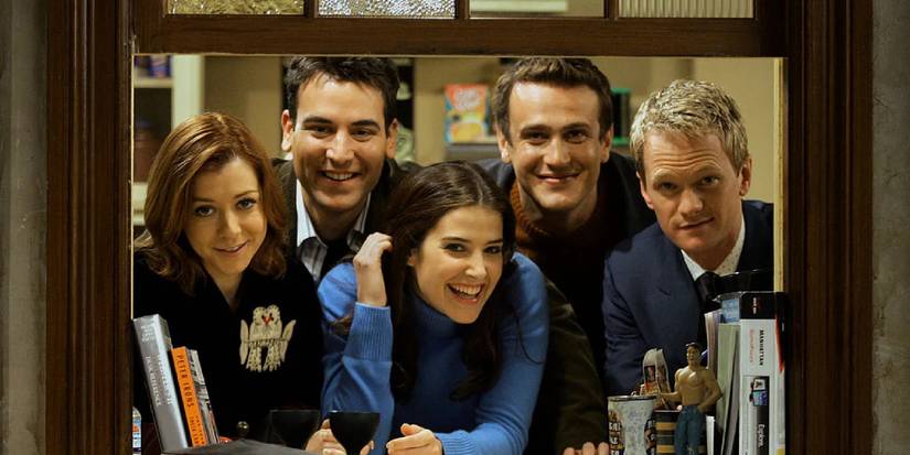 The cast of How I Met Your Mother posing on a window frame in a promotional shoot for the series.