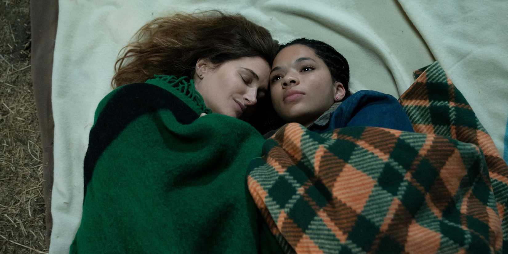 Kathryn Hahn as Clare and Tanzyn Crawford as Rae lying outside on blanket in Tiny Beautiful Things
