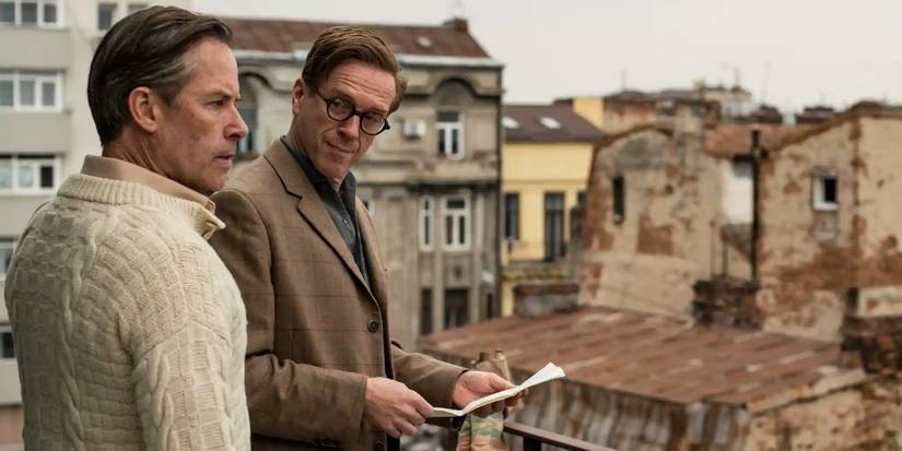 Guy Pearce as Kim Philby and Damian Lewis as Nicholas Elliott standing on a rooftop on 'A Spy Along Friends'