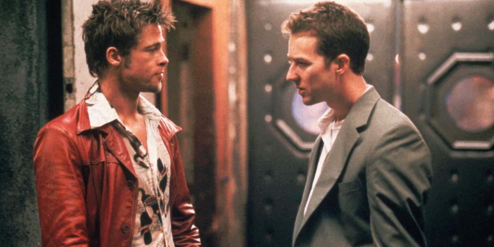 Brad Pitt and Edward Norton looking at each other in Fight Club