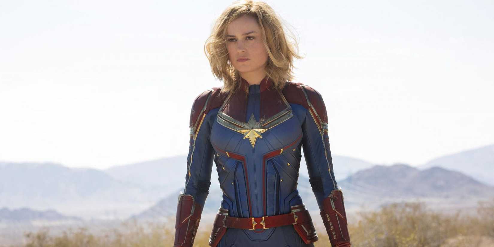 Brie Larson as Captain Marvel standing in the desert in Captain Marvel.