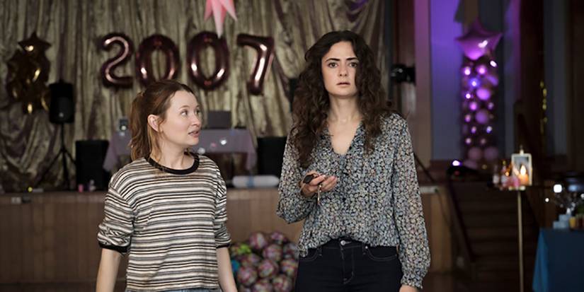 Two women standing at a high school reunion in Class of '07