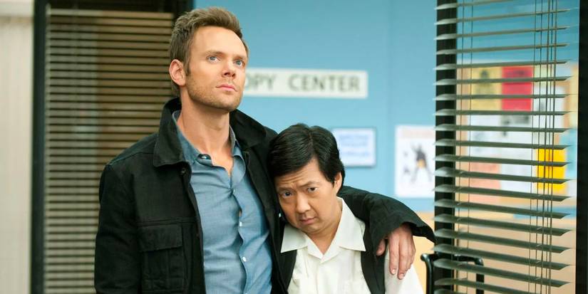 Joel McHale as Jeff Winger and Ken Jeong as Ben Chang hug it out in a scene from Community