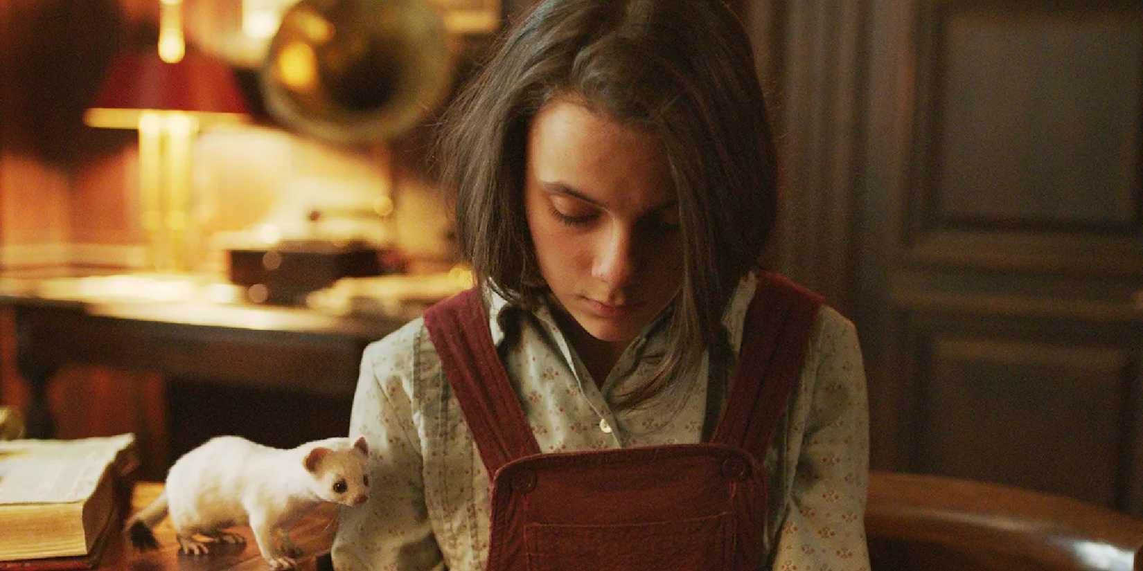 Dafne Keen in His Dark Materials looking down.