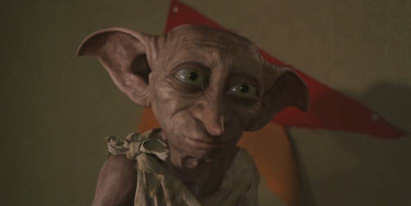 Dobby looking up and smiling softly in Harry Potter and the Chamber of Secrets