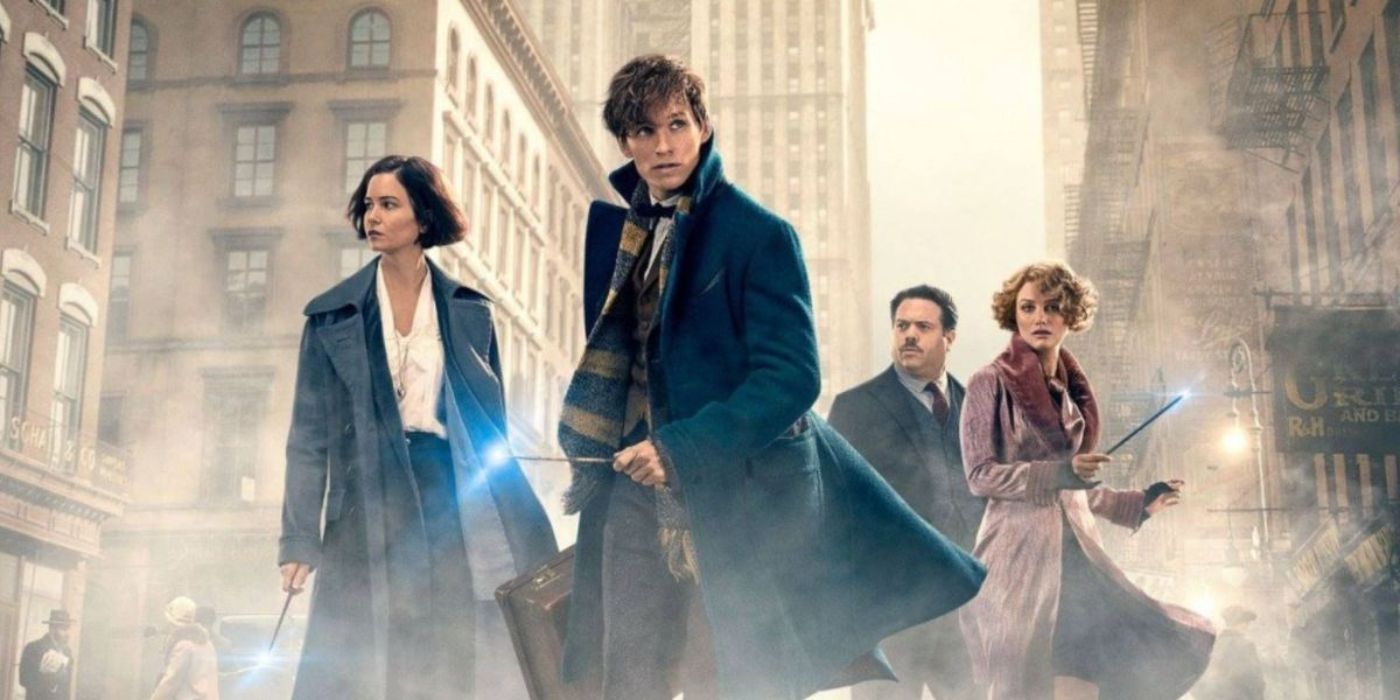 The four main characters from Fantastic Beasts and Where to Find Them posing surrounded by fog in a London city.