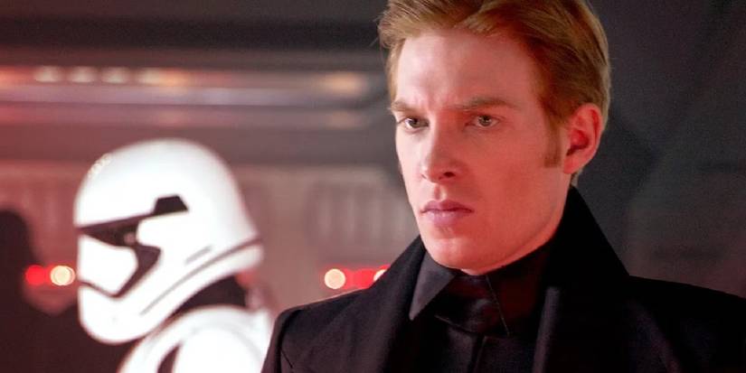 Domhnall Gleeson as General Hux scowling with Stormtroopers behind in The Force Awakens.