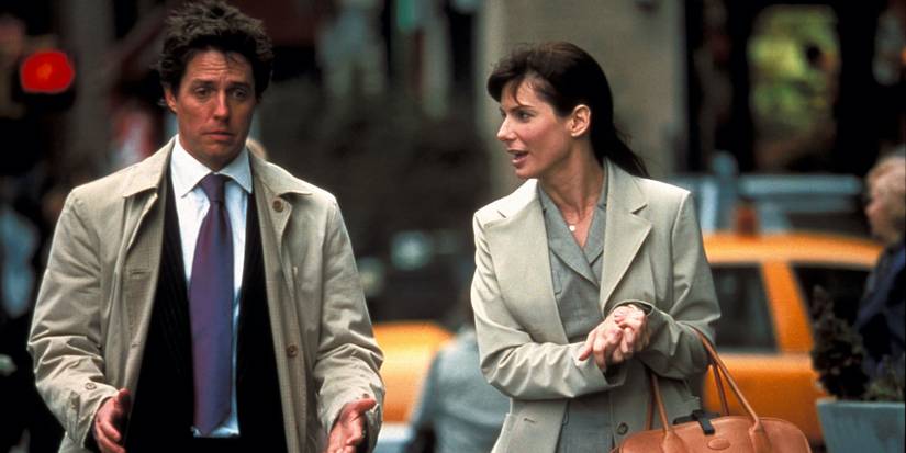 Hugh Grant sebagai George dan Sandra Bullock ketika Lucy berjalan -jalan di kota dalam pemberitahuan dua minggu.