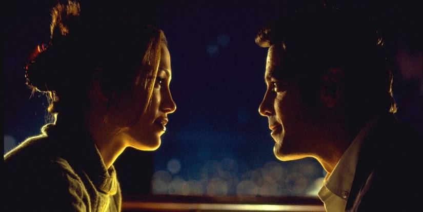 Jennifer and Lopez and George Clooney gaze at each other in profile in Out of Sight