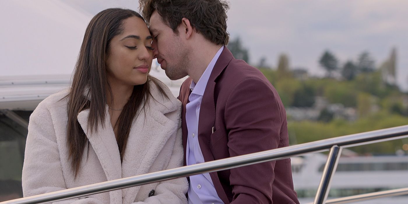 Zack Goytowski and Bliss Poureetezadi cuddling on a boat in Season 4, Episode 8 of Love is Blind. 