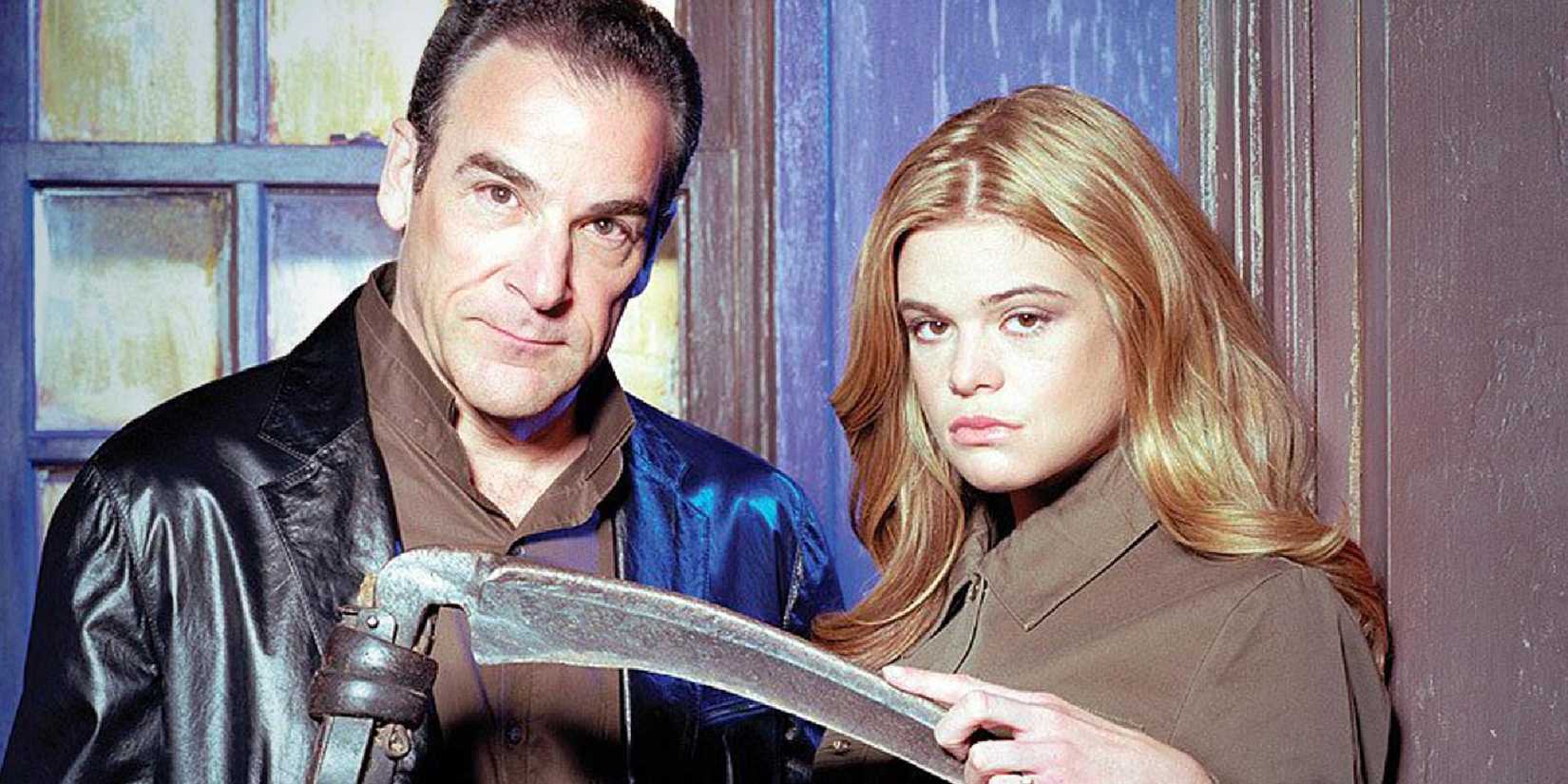 Mandy Patinkin and Ellen Muth in Dead Like Me hold a scythe and look at the camera.