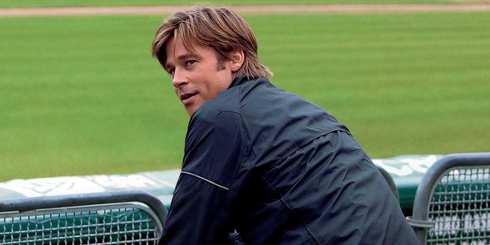 Brad Pitt as Billy Beane turning around to look to the distance in Moneyball.