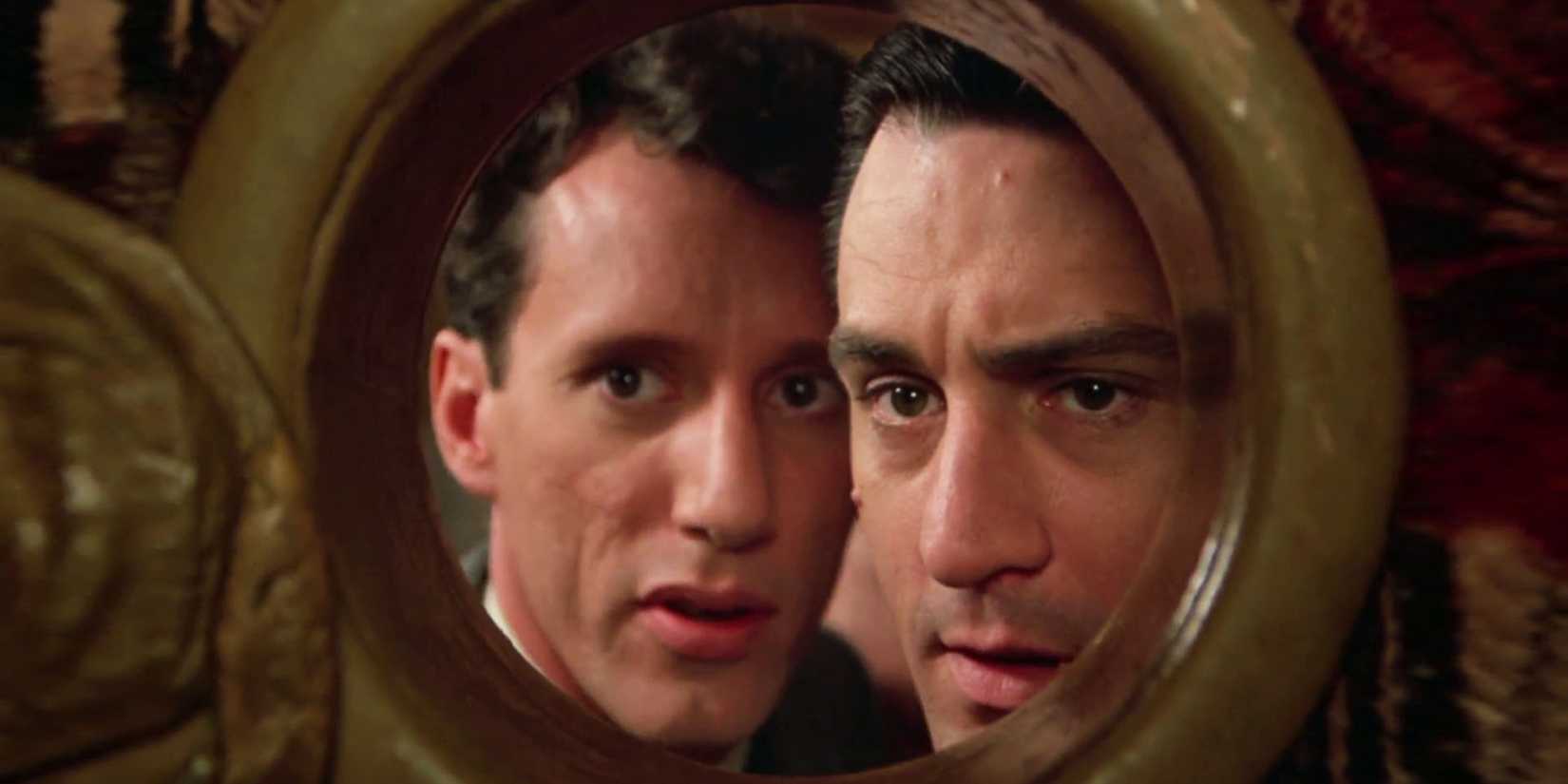 Max & Noodles look through a round window in Once Upon a Time in America