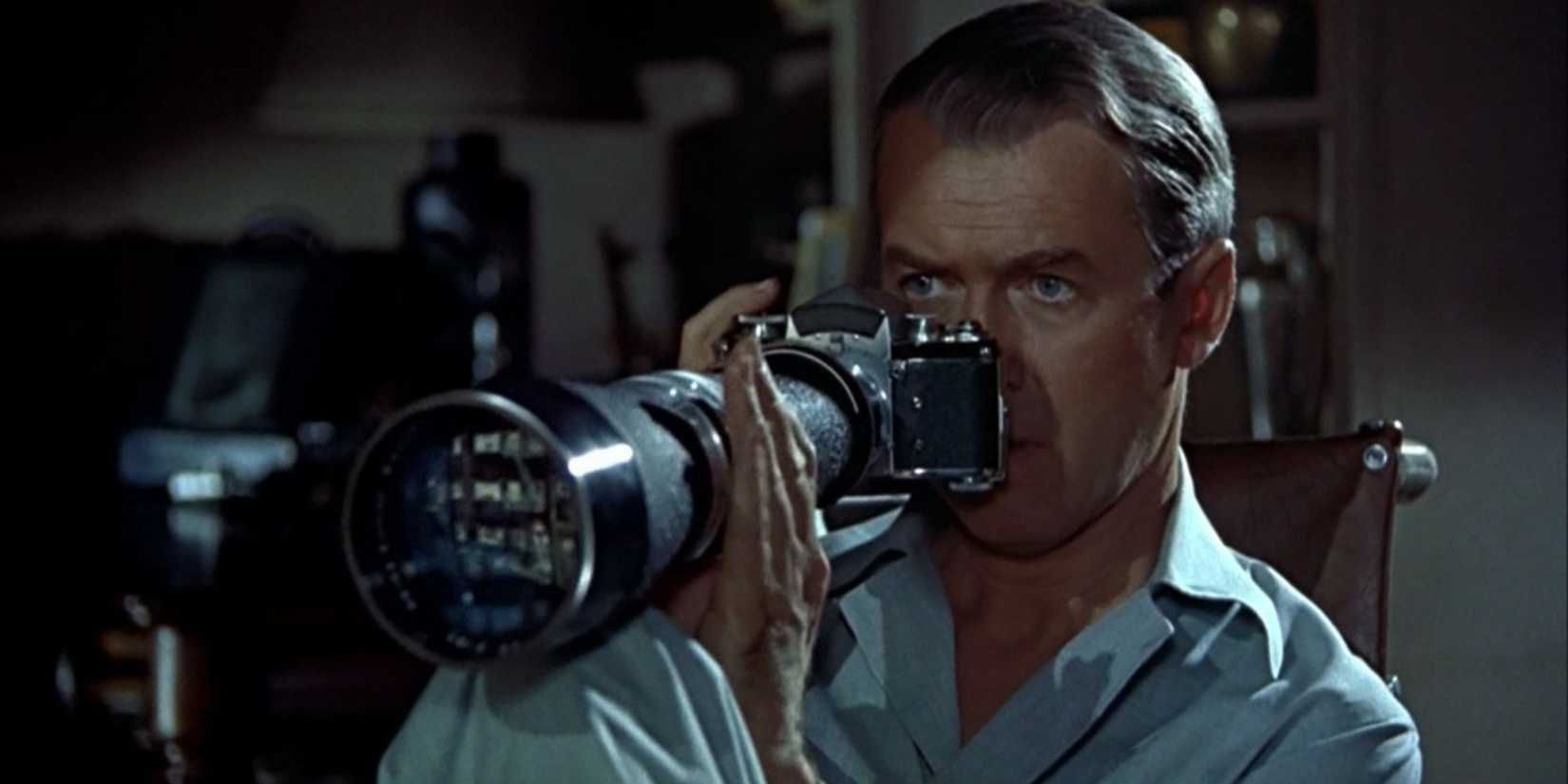 Jeff, played by Jimmy Stewart, aiming his camera in Rear Window
