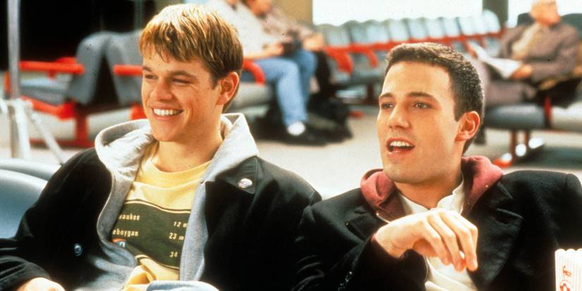 Matt Damon and Ben Affleck sit next to each other and laugh in Dogma.