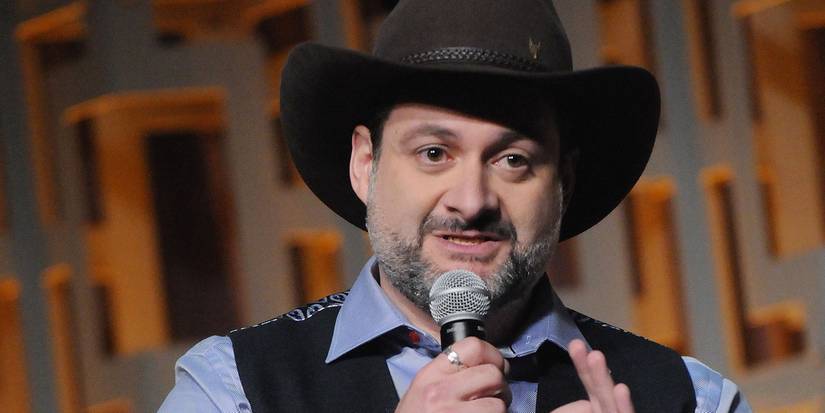 Dave Filoni on stage talking into a mic at Star Wars Celebration 40th Anniversary