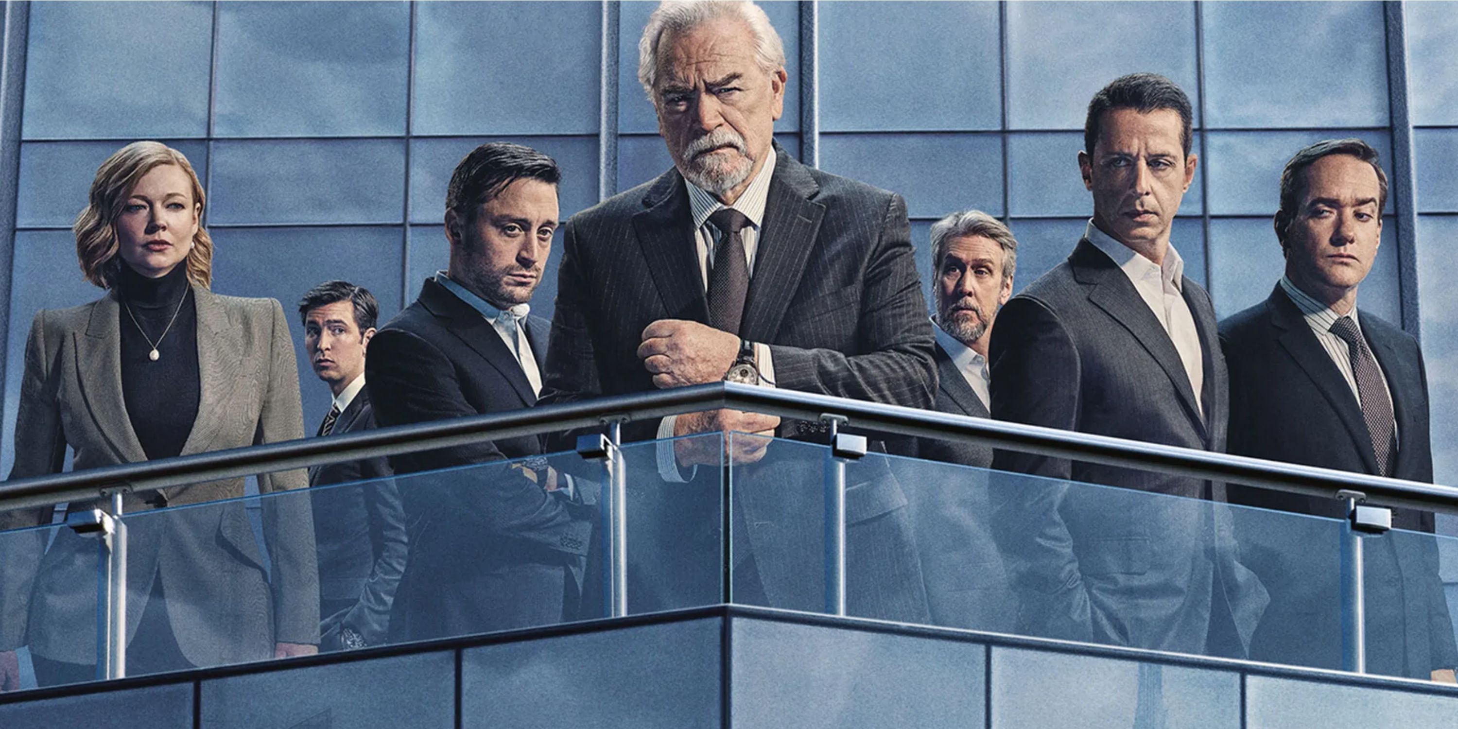 The main characters from Succession Season 4 standing atop a skyscraper.