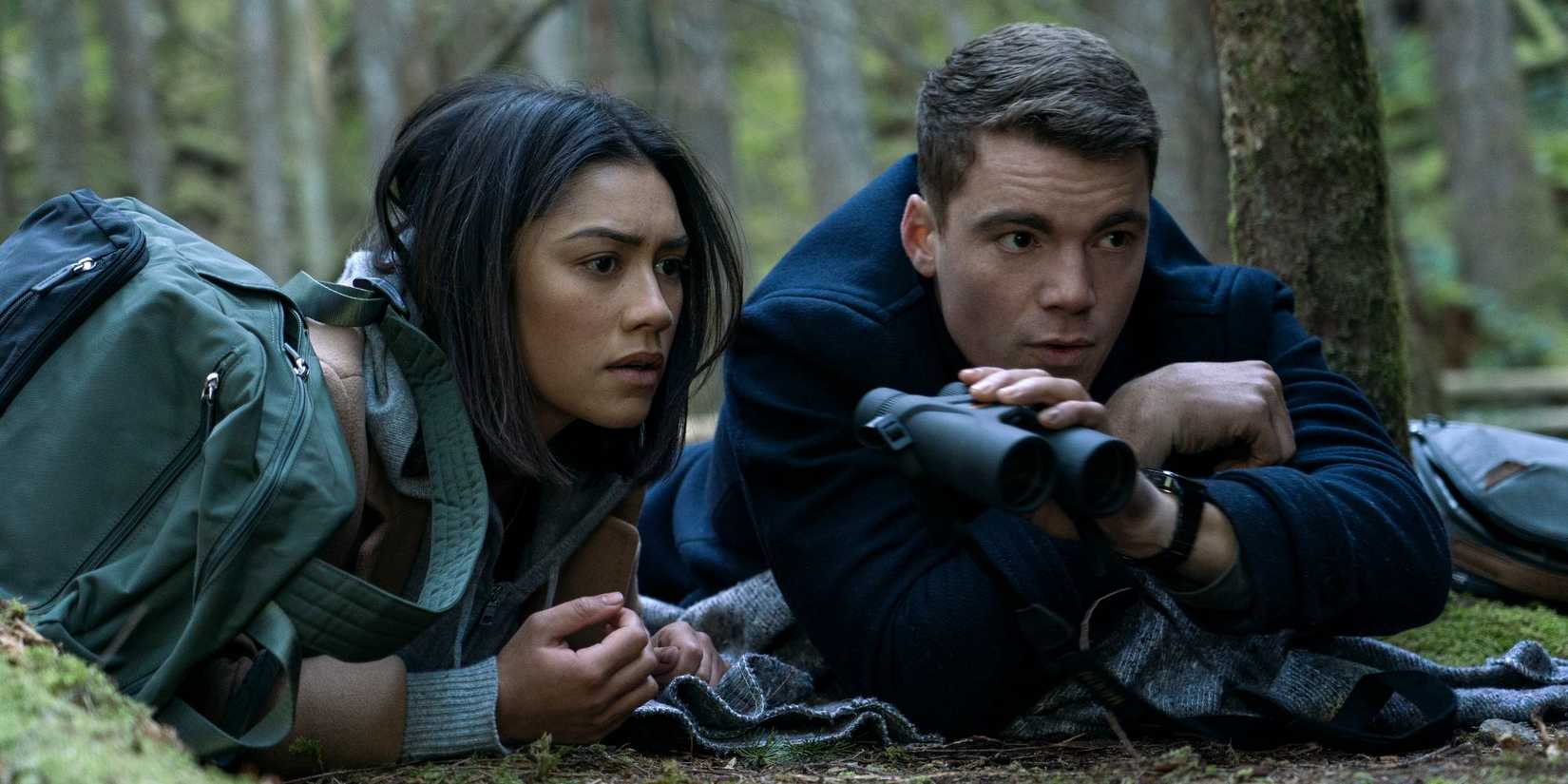Peter and Rose hiding in the forest in The Night Agent