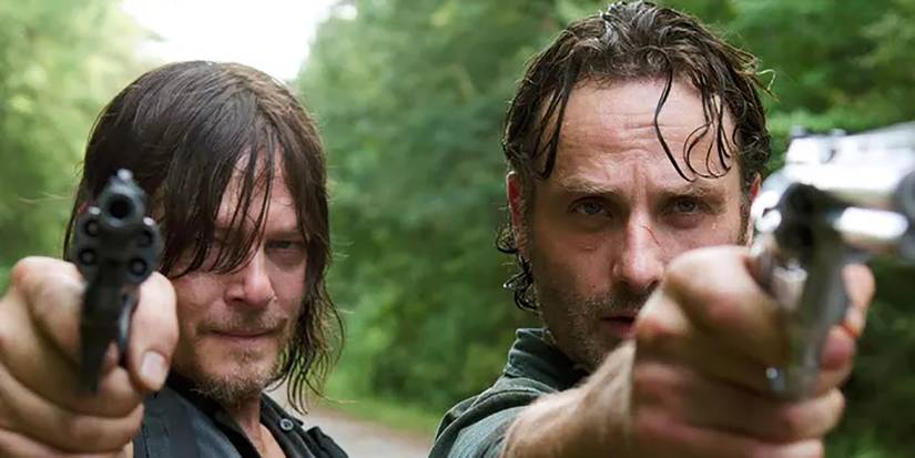 Daryl and Rick from The Walking Dead pointing guns side by side.