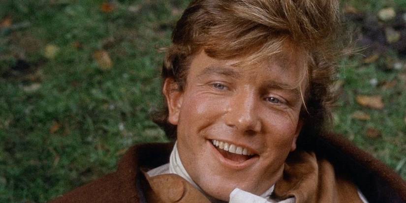 Albert Finney as Tom Jones, lying on the ground and smiling in Tom Jones.