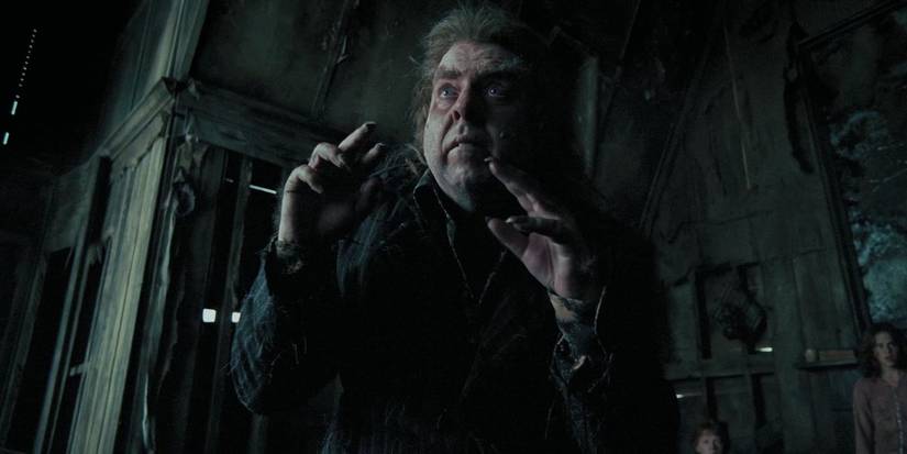 Peter Pettigrew with his hands up and looking concerned in Harry Potter and the Prisoner of Azkaban