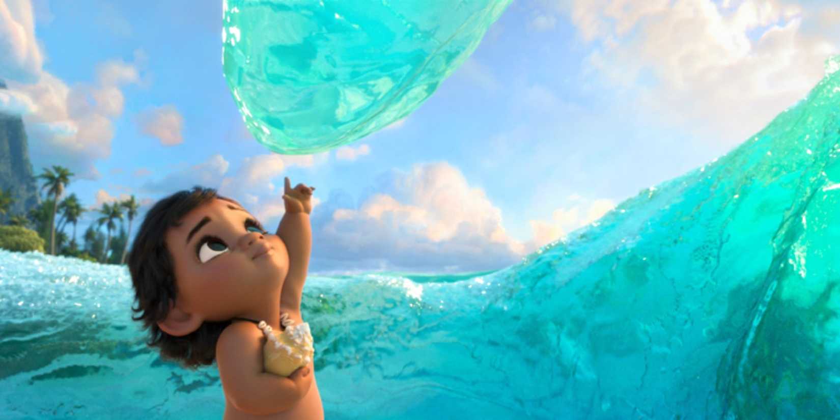 Baby Moana touches the water in Moana (2016)