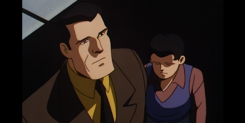Bruce Wayne stands with a sorrowful Dick Grayson