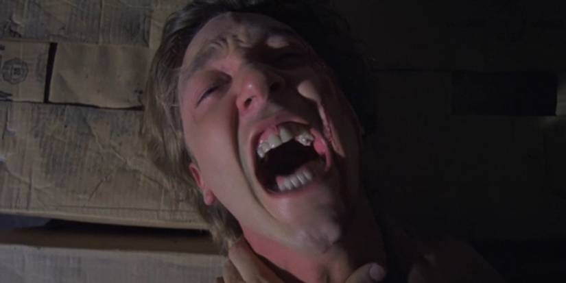 Burr Steers screams as a cardboard baler descends towards his head in Intruder (1989)