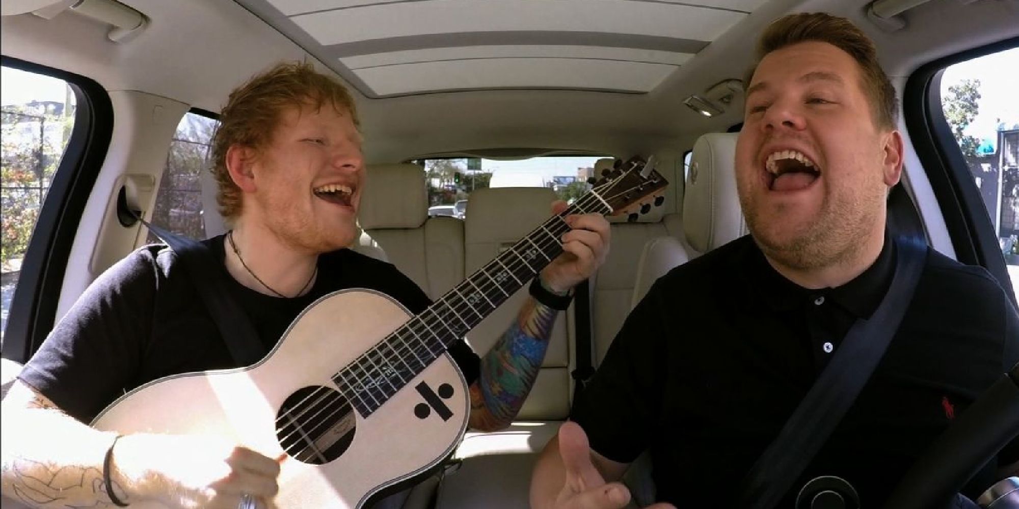 Ed Sheeran playing the guitar in James Corden's Carpool Karaoke