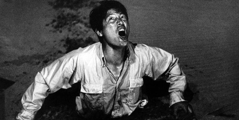 Eiji Okada screaming inside quicksand in 'Woman in the Dunes'