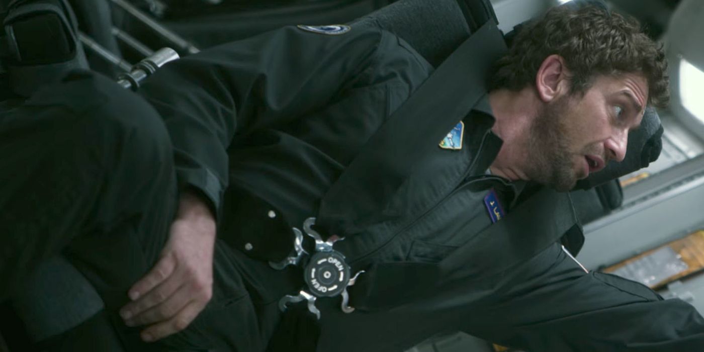 Gerard Butler as Jake Lawson strapped into a space ship in Geostorm