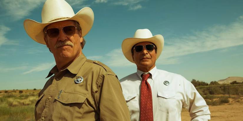 Marcus Hamilton and Alberto Parker looking at a person offscreen in 'Hell or High Water'.