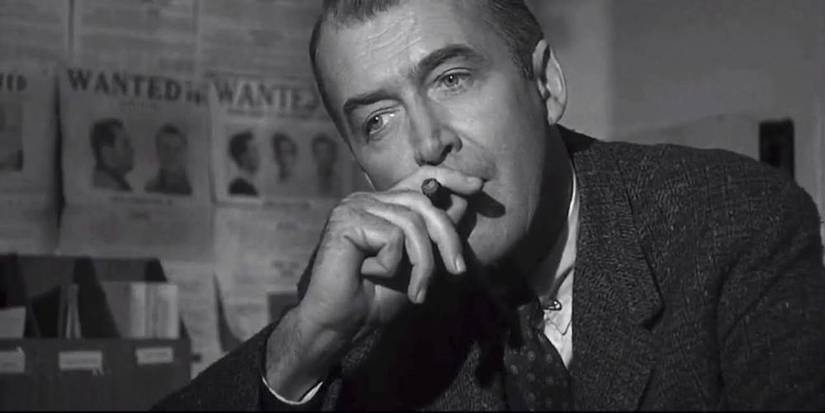 Jimmy Stewart smoking a cigar and staring in Anatomy of a Murder
