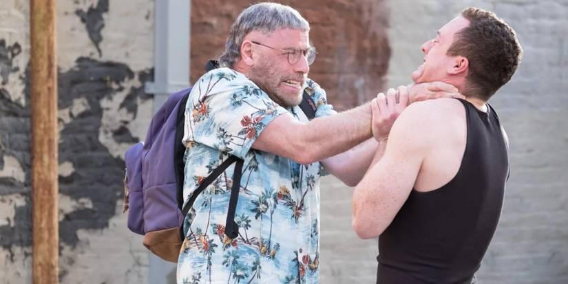 John Travolta as Moose choking a man in The Fanatic 