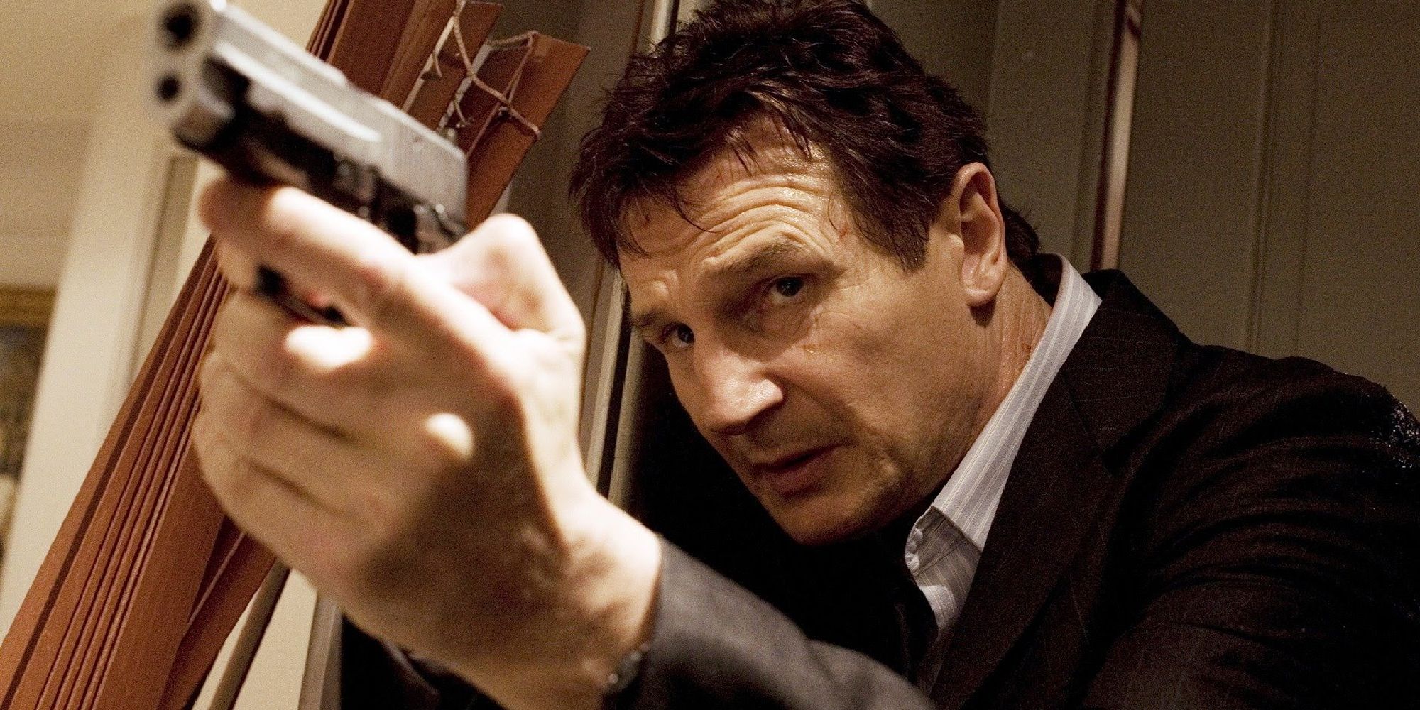 Liam Neeson aiming a gun in Taken