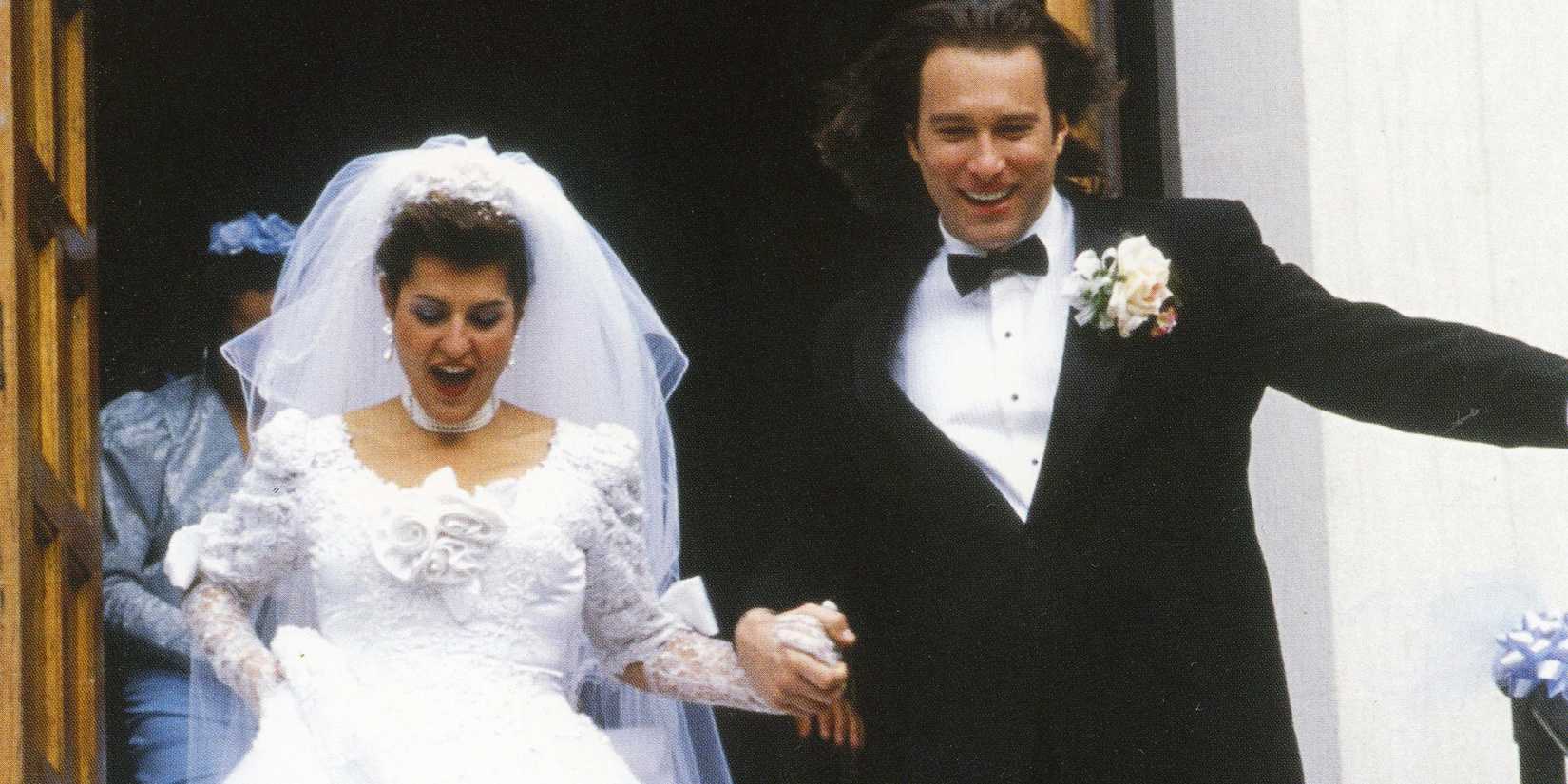 Toula and Ian walking down church steps after getting married in My Big Fat Greek Wedding