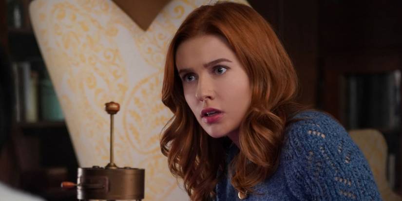 Kennedy McMann as Nancy in a blue sweater, looking to the side, perplexed in Nancy Drew.