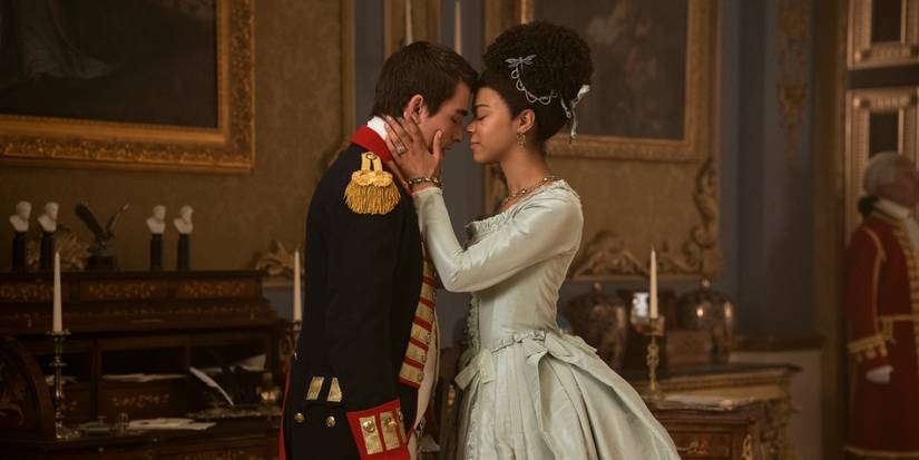 Corey Mylchreest as King George and India Amarteifio as Queen Charlotte about to kiss in 'Queen Charlotte'