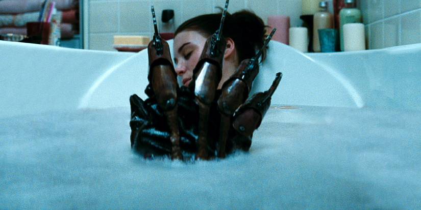 Rooney Mara in a bath with Freddy's gloved hand in between her legs in A Nightmare on Elm Street 2010 Remake