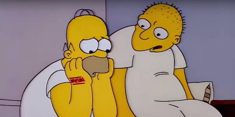 Homer frowning with his head in his hands while Michael, voiced by Michael Jackson, sits beside him in The Simpsons Season 3 "Stark Raving Dad"