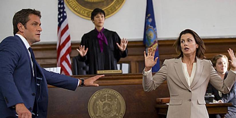 ADA Kate Moynahan with her hands up in the courtroom.