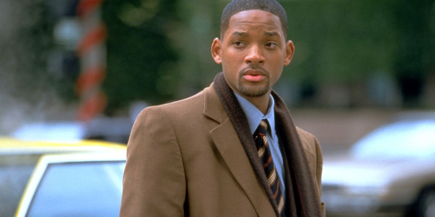 Will Smith standing by a city street in Enemy of the State